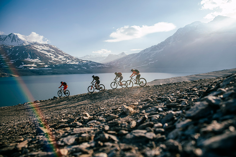 People riding bikes, mountains